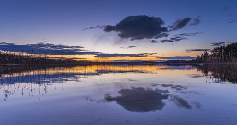 Calm lake water in the evening blue hour