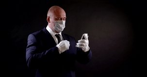 man with mask on face for protection from respiratory viruses is communicating by video call by smartphone
