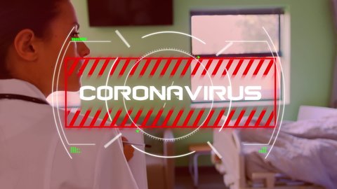 Animation of the word Coronavirus written in white in red frame over a female doctor walking through a hospital room in a hospital room and coronavirus Covid-19 spreading. Medicine public health