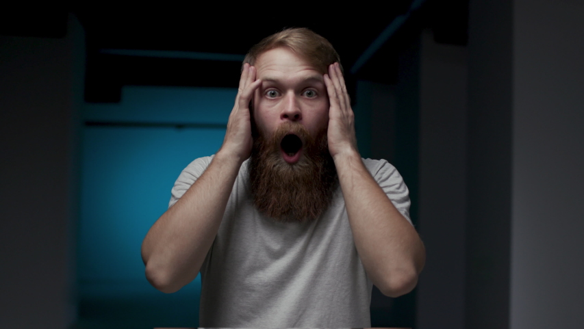 One Man Emotionally Frightened and Shocked by Seen. Concept Emotions and Human Fear. Face Man in Horror from Bad News. 30s Sad Guy Open Mouth Hold on to Head. Desperate Person in Sorrow and Depression