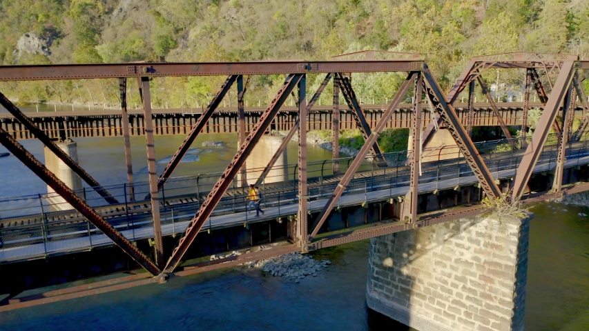 Aerial View, Couple Walking on Historical Harpers Ferry Bridge, West Virginia
