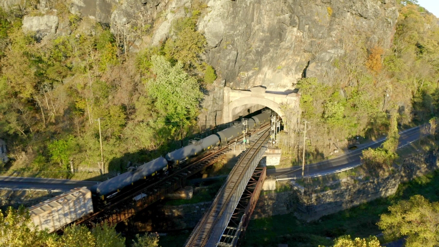 Aerial View Above Trains Entering Tunnel in Harpers Ferry, West Virginia