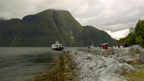 Ferry Boat Crosses The Fjords Of Urke in Norway