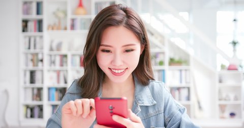 Asian girl student use mobile phone happily