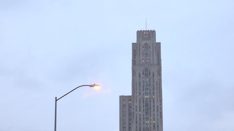 Pittsburgh, PA / USA - March 30, 2019: University of Pittsburgh Oakland Campus Cathedral of Learning Coronavirus Victory Lights Summer Fall Spring Winter Aerial 4K