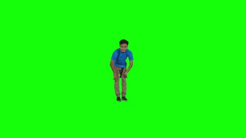 Teenage boy performing hip hop dance in the studio. Shot in 4k resolution with green screen background