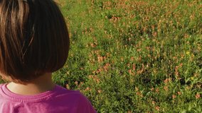 Young girl walking around flowers. Texas, USA. - Powered by Shutterstock - Get 15% off with code: PIKWIZARD15