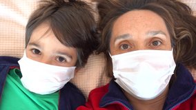 4K Selfie - Cheerful mother and child in masks look at each other
 - Powered by Shutterstock - Get 15% off with code: PIKWIZARD15