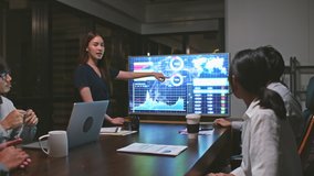 Young Asian businesswoman lead group of business financial team in strategic meeting presentation, work late night in office. Marketing strategy analysis, stock market trading, or corporate teamwork - Powered by Shutterstock - Get 15% off with code: PIKWIZARD15