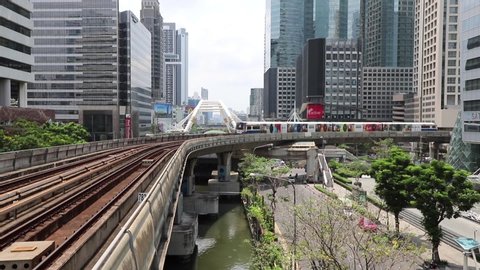 BTS Skytrain in Bangkok, passing train in the background of the city. Thailand Bangkok March 2020