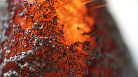 Hot glowing ash, incense burning macro, ash coal texture detail