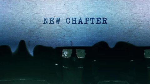 New Chapter Word closeup Being Typing and Centered on a Sheet of paper on old vintage Typewriter mechanical 4k Footage Background Animation.