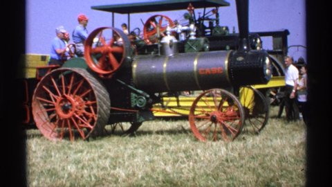MINNESOTA-1971: A Steam Powered Tractor Whirs To Life And Begins Advancing Forward Slowly Building Power