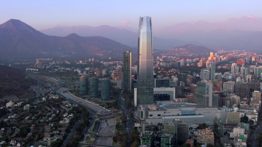 Aerial view of Santiago, the capital and largest city in Chile, showing landmark buildings in the financial district at sunset. | Shutterstock HD Video #1049695912