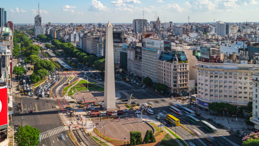 Time lapse view of historical landmark Obelisk of Buenos Aires and traffic on 9 de Julio Avenue during summer in Buenos Aires, Argentina. Royalty-Free Stock Footage #1049698744