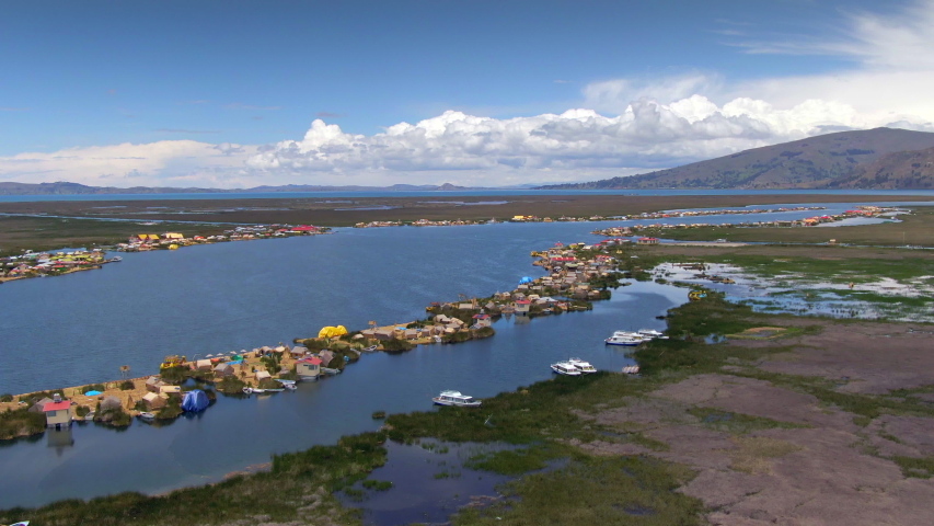 Aerial view of Uros Floating Islands (Spanish: Islas Uros ) on Lake Titicaca, the highest navigable lake in the world, on the border of Peru and Bolivia, South America. 