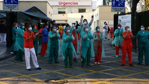 Nursing staff of the Gregorio Marañon Hospital in Madrid greeting the Police for the state of alarm in Spain by COVID-19. Filmed on April 3, 2020.