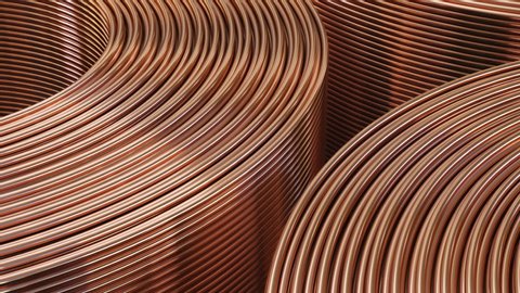 Copper pipes close-up. Coils with tubes in warehouse.