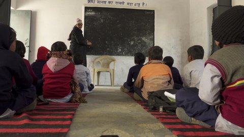 Uttarkashi,Uttarakhand/India-March 22 2020: Coronavirus India Lockdown, schools before lockdown. Teachers teaching about social distancing & deadly COVID-19, a deadly virus.