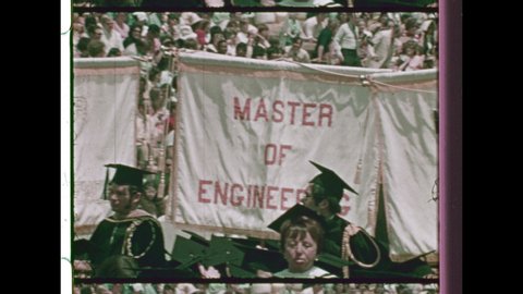 1970's Los Angeles. Students gather for Graduation Ceremony from a school that Awards advanced Academic Degrees. 4K Overscan of 16mm Film Showing Frame Lines and Sprocket Holes