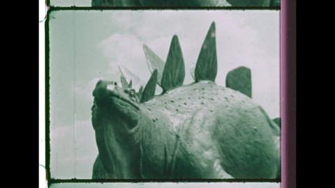 1970's Rapid, Kinetic Montage of Dinosaur Statues. 4K Overscan of 16mm Film Showing Frame Lines & Sprocket Holes  