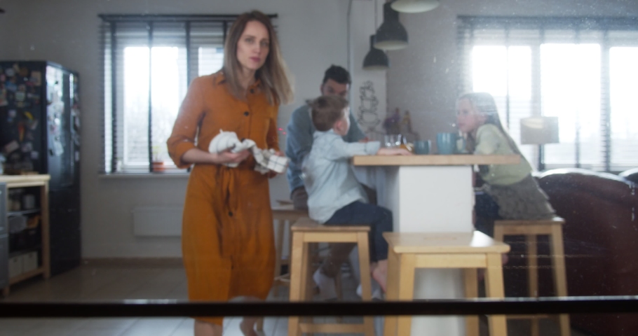 Cooking at home with family. POV young happy Caucasian woman taking cupcakes out of oven on celebration day slow motion.