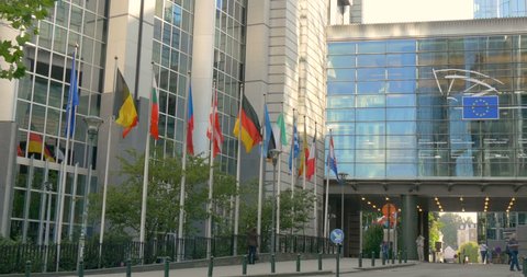 Brussels Belgium Europe 14 SEP 2014: European Union (EU) Parliament building architecture, modern euro politics office with all countries flags, symbol of international law institution, Bruxelles city