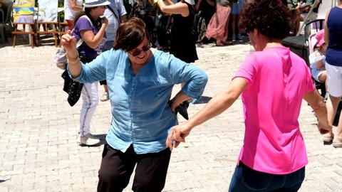 izmir, turkey - june 30 / 2019 : people dancing with local turkish music at lavender fest in front of crowd of visitors