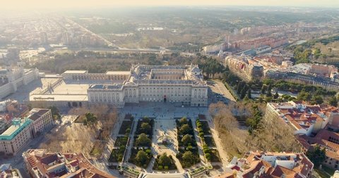Aerial 4K video of Madrid Cathedral Santa Maria la Real de La Almudena in Madrid, Spain and Royal Palace at sunset. Architecture and landmark of Madrid. Cityscape of Madrid