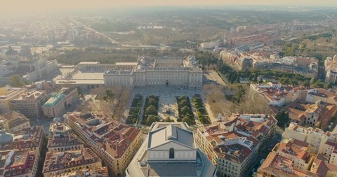 Aerial 4K footage of Madrid Cathedral Santa Maria la Real de La Almudena in Madrid, Spain and Royal Palace at sunset. Architecture and landmark of Madrid. Cityscape of Madrid