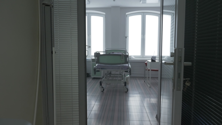 camera approaches an empty medical bed, empty medical ward, intensive care unit