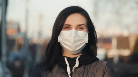 Virus mask spanish woman on street wearing face protection take off mask end finish coronavirus covid 19 quarantine. End pandemic epidemic