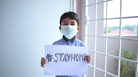 Stay at home .Coronavirus covid-19 infected.Asian Boy Wearing Masks to Prevent Disease and Dust, pm.5,Stay at home quarantine coronavirus pandemic prevention.