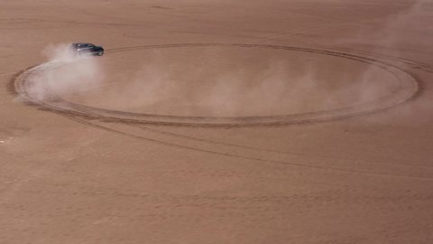 aerial view of the outgoing car in the desert lake is located in turkey
