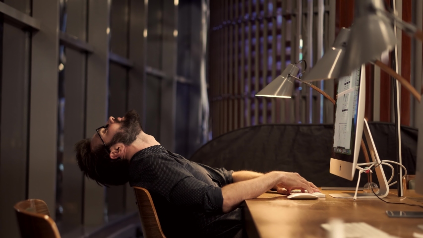 Tired Businessman Sleeping On Workplace.Frustrated Businessman Working Alone.Office Work Overtime. Workaholic Work In Internet Deadline.Tired Overwhelmed Exhausted Stressed Businessman In Night Office | Shutterstock HD Video #1049833240