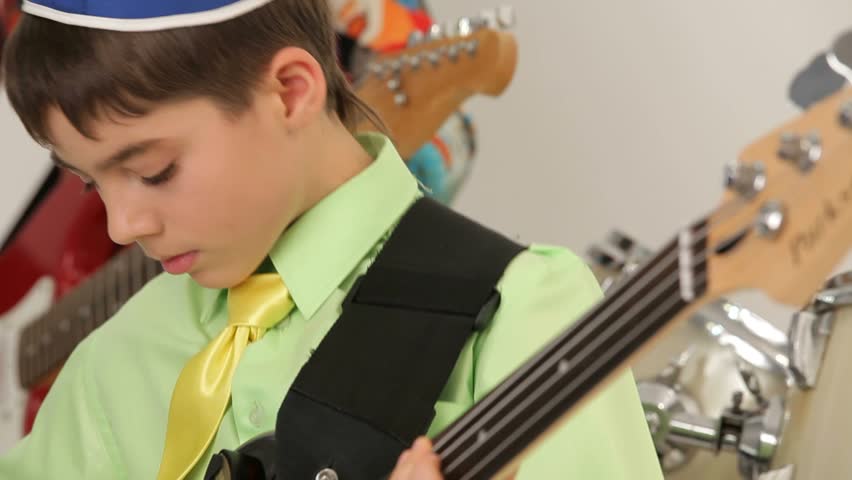 Young Jew guitarist playing. Concert instrumental ensemble.