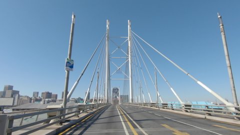 A tracking shot on Nelson Mandela bridge heading towards the Johannesburg CBD to show how empty and quiet the city is during Covid-19 Coronavirus lockdown. 