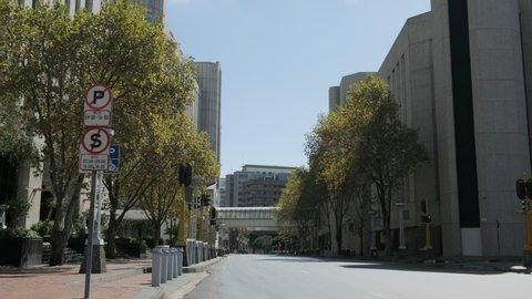 A wide shot of a quiet, empty street in Johannesburg city centre during the covid-19 coronavirus lockdown. 
