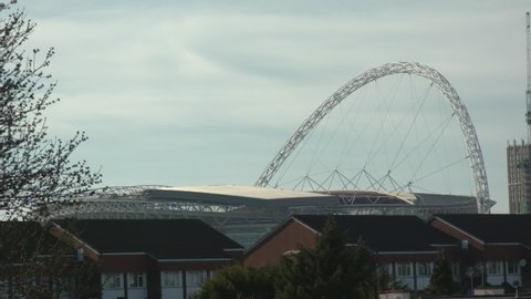 London, UK - April 05 2020: Wembley Stadium arch over suburban houses