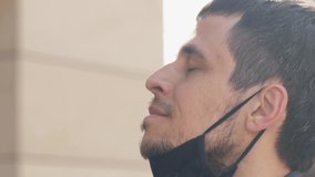 Coronavirus is defeated. Man takes off a protective mask. - Powered by Shutterstock - Get 15% off with code: PIKWIZARD15