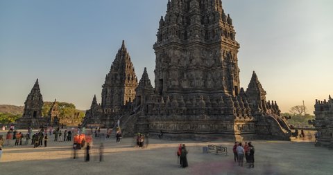 Prambanan, Indonesia - July 17, 2019: Timelapse from the people and tourists visiting the ancient temple of Prambanan close to Yogyakarta, in Central Java, Indonesia, photographed in the afternoon.