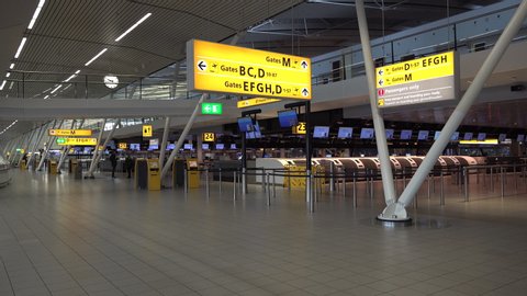 SCHIPHOL, THE NETHERLANDS – 1 APRIL 2020: Empty departure hall of one of Europe's busiest airports Schiphol, corona virus Covid-19 consequences for global aviation industry
