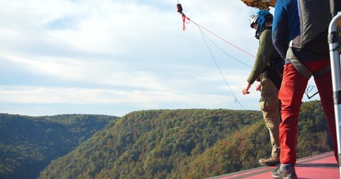 Fayetteville, Tennessee / USA - November 14 2019: A Man Base Jumping Off Bridge With Parachute, Slow Motion Jump