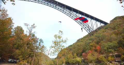 Fayetteville, Tennessee / USA - November 14 2019: Man Base Jumping With Parachute, Slow Motion, Forest Landscape