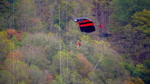 Fayetteville, Tennessee / USA - November 14 2019: Man With Parachute in Forest, Base Jumping, Slow Motion