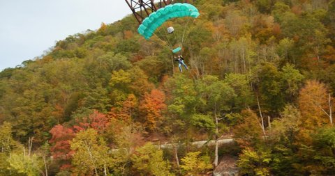 Fayetteville, Tennessee / USA - November 14 2019: Base Jumper with Parachute Coming In For Landing, Slow Motion