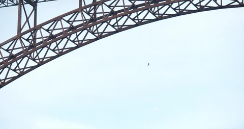 Fayetteville, Tennessee / USA - November 14 2019: Man Base Jumping Off Bridge With Parachute