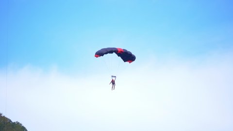 Fayetteville, Tennessee / USA - November 14 2019: Parachuting Through Beautiful Blue Sky, Sky Diving, Base Jumping