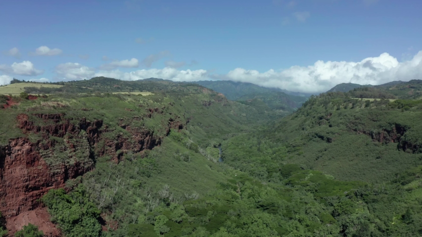South Kauai Hanapepe Valley Lookout drone view. Aerial lifting panorama rising shot of canyon on picture perfect sunny day