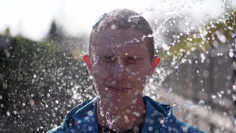 Funny Man Face Hit by a Water Balloon, Slow Motion